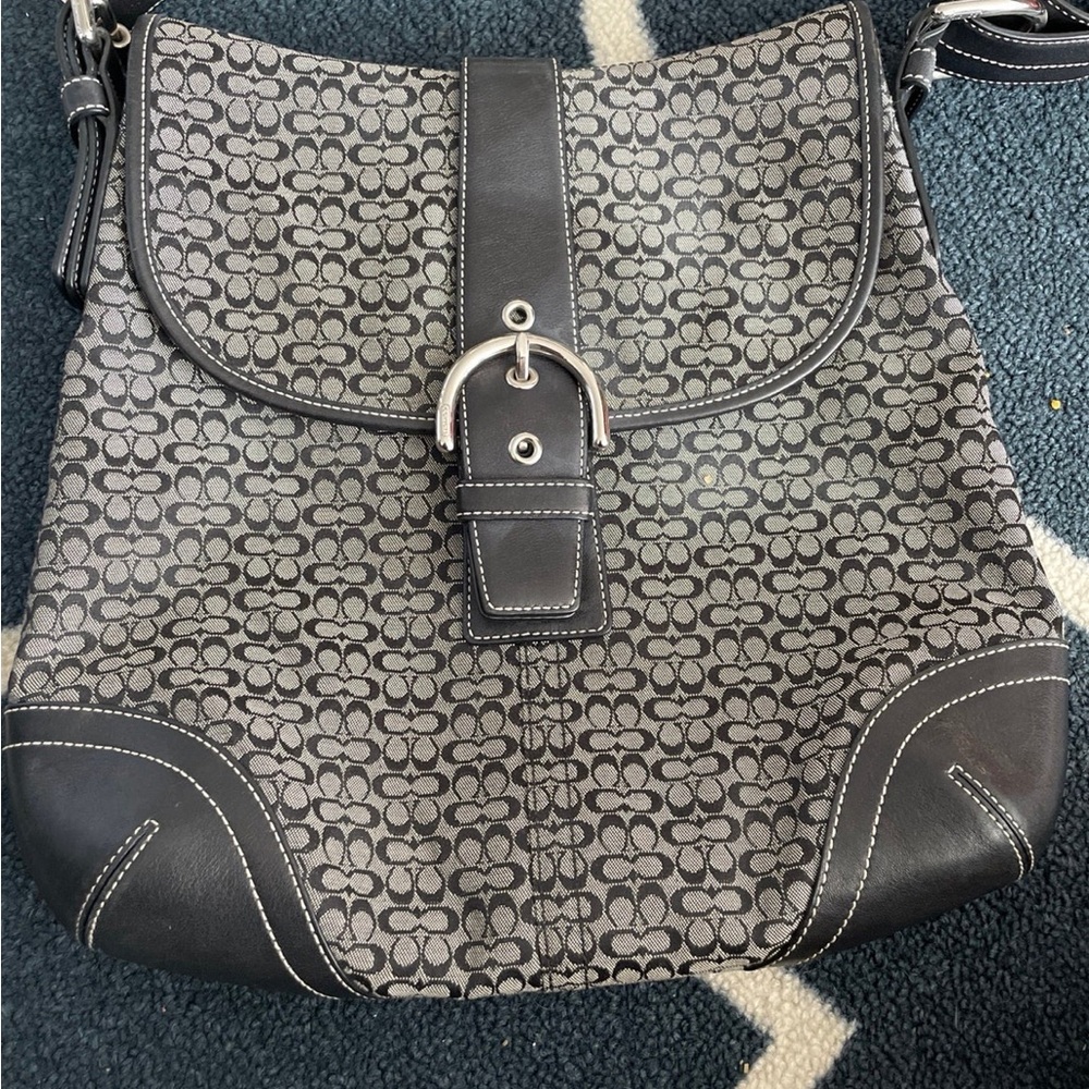 Black coach signature handbag. Like new. Used only handful of times.
